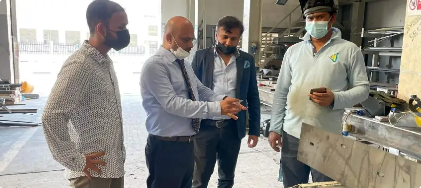 ISO consultants reviewing operational processes during on-site assessment in UAE facility